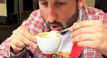 Man stirring cappuccino